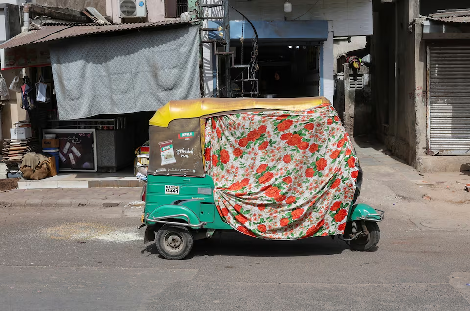 an autorickshaw covered with a cloth is seen on the street during a heat wave in ahmedabad india may 30 2024 photo reuters