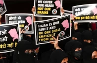 women hold placards during a protest organised by hum bhartiya against the recent hijab ban in few colleges of karnataka state on the outskirts of mumbai india february 11 2022 photo reuters