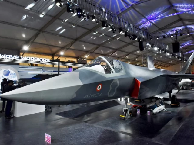 visitors stand next to a prototype of the advanced medium combat aircraft amca india s most advanced stealth fighter jet at the aero india 2025 air show at yelahanka air base in bengaluru india february 11 2025 reuters visitors stand next to a prototype of the advanced medium combat aircraft amca india s most advanced stealth fighter jet at the aero india 2025 air show at yelahanka air base in bengaluru india february 11 2025 reuters