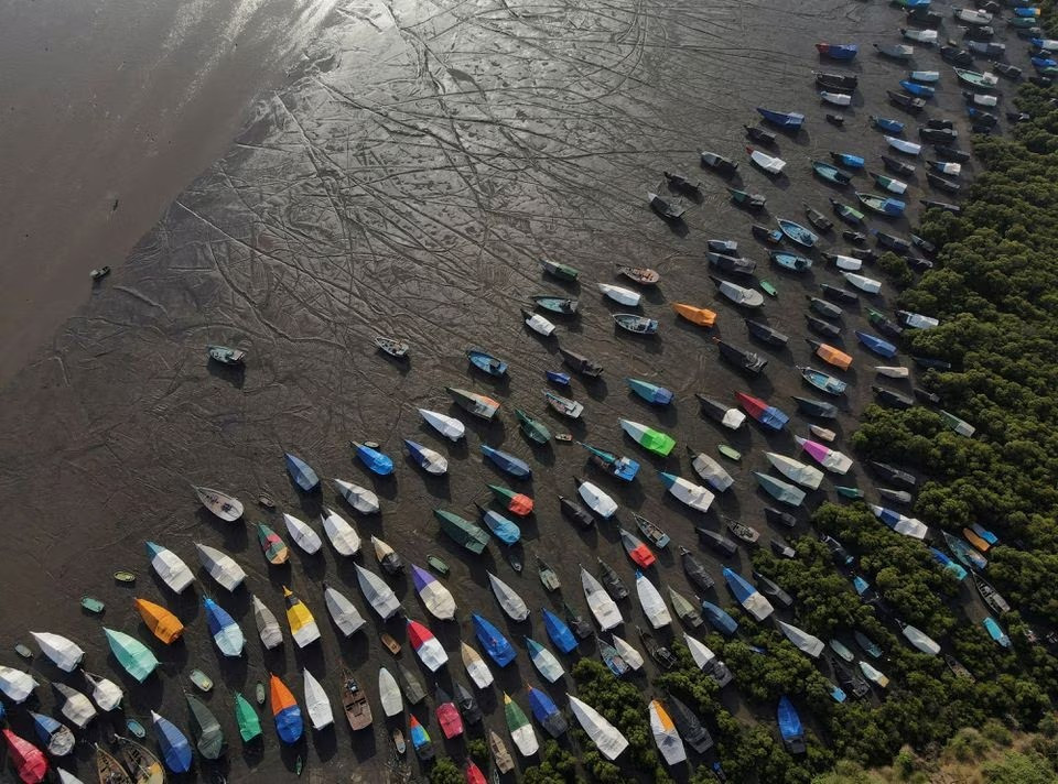 an aerial view of fishing boats covered with tarpaulin sheets parked on the shore before the start of the monsoon season on the outskirts of mumbai india june 8 2023 photo reuters