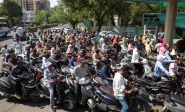 people queue to fill petrol in their two wheelers with concerns over potential supply disruptions but authorities say there are no shortages amid the ongoing us israeli conflict with iran in ahmedabad india march 23 2026 photo reuters