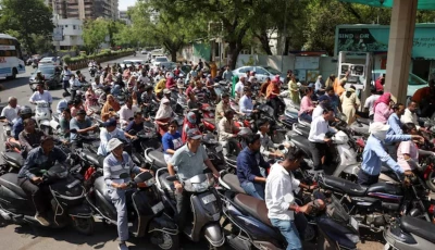 people queue to fill petrol in their two wheelers with concerns over potential supply disruptions but authorities say there are no shortages amid the ongoing us israeli conflict with iran in ahmedabad india march 23 2026 photo reuters