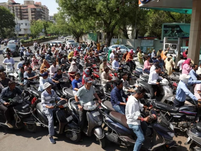 people queue to fill petrol in their two wheelers with concerns over potential supply disruptions but authorities say there are no shortages amid the ongoing us israeli conflict with iran in ahmedabad india march 23 2026 photo reuters people queue to fill petrol in their two wheelers with concerns over potential supply disruptions but authorities say there are no shortages amid the ongoing us israeli conflict with iran in ahmedabad india march 23 2026 photo reuters