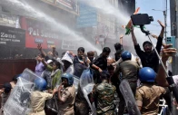 students gesture as police use water cannons to disperse them during a protest demanding cancellation of a civil services recruitment examination over allegations of question paper leaks and other irregularities in patna india august 25 2026 reuters