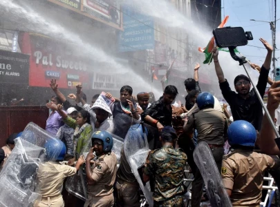 indian police use water cannon at new protest over test paper leaks