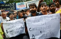 supporters of india s cockroach janta party cjp hold placards two days after thousands of protesters marched towards parliament demanding the resignation of education minister dharmendra pradhan over examination paper leaks at jantar mantar in new delhi india july 22 2026 photo reuters