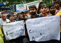 supporters of india s cockroach janta party cjp hold placards two days after thousands of protesters marched towards parliament demanding the resignation of education minister dharmendra pradhan over examination paper leaks at jantar mantar in new delhi india july 22 2026 photo reuters
