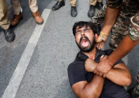a protester is detained by security personnel during a protest by the cockroach janta party cjp seeking the resignation of india s chief election commissioner gyanesh kumar near the protest site in new delhi india october 11 2026 photo reuters