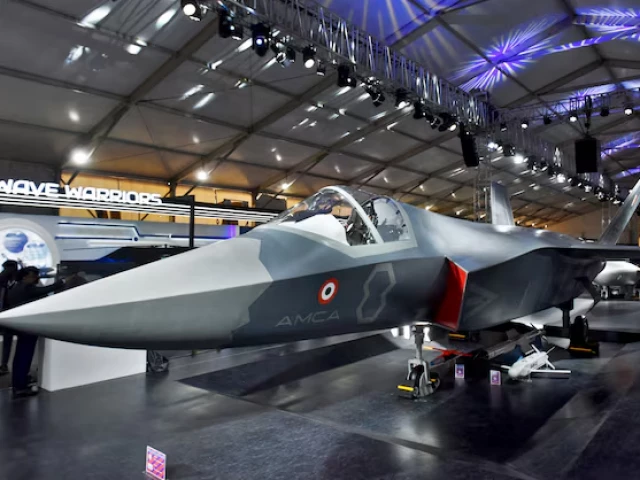 visitors stand next to a prototype of the advanced medium combat aircraft amca india s most advanced stealth fighter jet at the aero india 2025 air show at yelahanka air base in bengaluru india february 11 2025 photo reuters
