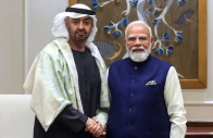 this handout photograph taken and released by the indian press information bureau pib on january 19 2026 shows uae president sheikh mohamed bin zayed al nahyan l shaking hands with india s prime minister narendra modi during their meeting in new delhi photo afp
