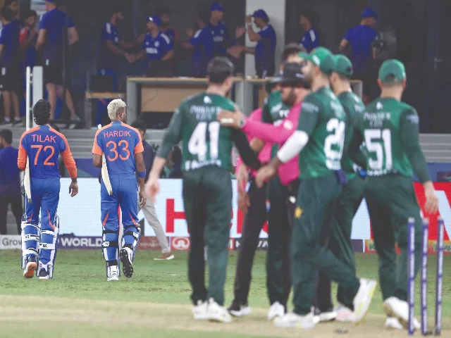india s tilak varma and hardik pandya walk back to the pavilion while pakistani players shake hands with the umpire after the asia cup 2025 super four t20 clash at dubai international stadium photo afp india s tilak varma and hardik pandya walk back to the pavilion while pakistani players shake hands with the umpire after the asia cup 2025 super four t20 clash at dubai international stadium photo afp