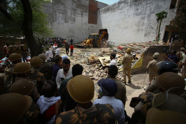 a bulldozer demolishes the house of a muslim man that uttar pradesh state authorities accuse of being involved in riots last week that erupted following comments about the prophet mohammed by india s ruling bharatiya janata party bjp members in prayagraj india june 12 2022 authorities claim the house was illegally built reuters ritesh shukla a bulldozer demolishes the house of a muslim man that uttar pradesh state authorities accuse of being involved in riots last week that erupted following comments about the prophet mohammed by india s ruling bharatiya janata party bjp members in prayagraj india june 12 2022 authorities claim the house was illegally built reuters ritesh shukla