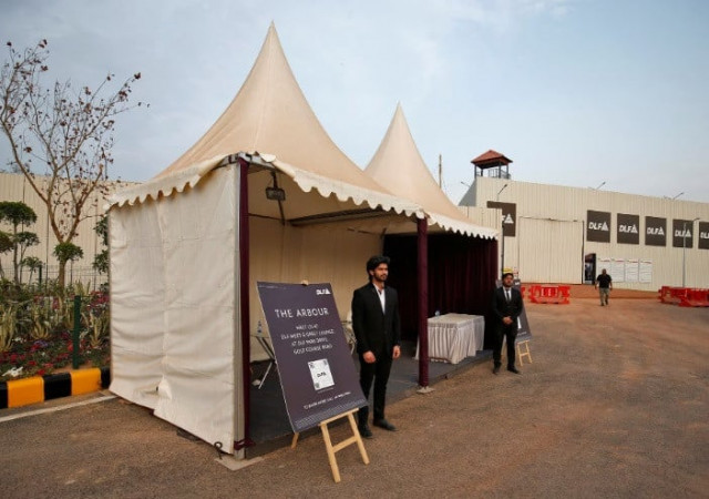 sales representatives stand outside their kiosks inside a luxury residential project by indian property developer dlf in gurugram india february 28 2023 reuters amit dave sales representatives stand outside their kiosks inside a luxury residential project by indian property developer dlf in gurugram india february 28 2023 reuters amit dave