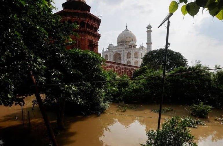 a flooded area is pictured near the historic taj mahal as the yamuna river overflows following heavy rains in agra india july 18 2023 reuters adnan abidi