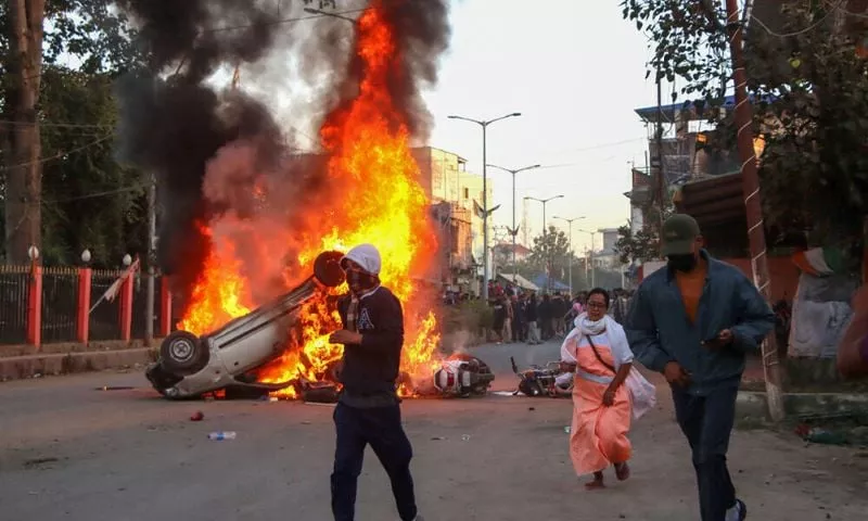 people run past burning vehicles of india s bharatiya janata party bjp mla during a protest to condemn the alleged killing of women and children in imphal capital of india s violence hit northeastern state of manipur on november 16 2024 an indian state riven by months of ethnic tensions imposed an internet shutdown and curfew november 16 after angry protests over the recovery of six bodies of people believed to have been kidnapped by insurgents photo afp people run past burning vehicles of india s bharatiya janata party bjp mla during a protest to condemn the alleged killing of women and children in imphal capital of india s violence hit northeastern state of manipur on november 16 2024 an indian state riven by months of ethnic tensions imposed an internet shutdown and curfew november 16 after angry protests over the recovery of six bodies of people believed to have been kidnapped by insurgents photo afp