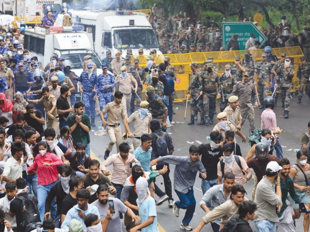state brutality police members use batons to disperse supporters of the cockroach janta party in new delhi photo reuters state brutality police members use batons to disperse supporters of the cockroach janta party in new delhi photo reuters