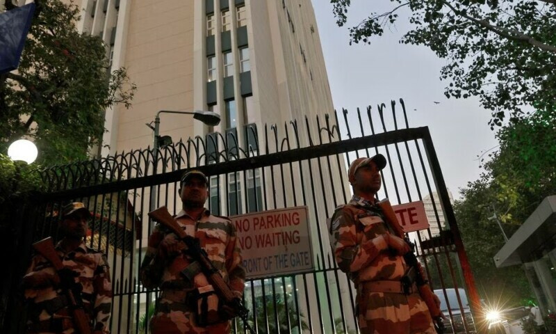 members of the indo tibetan border police itbp stand guard outside a building housing bbc offices where income tax officials are conducting a search for a second day in new delhi photo reuters