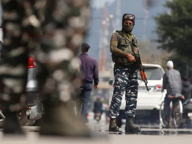 indian security personnel stand guard on a street in srinagar photo reuters file