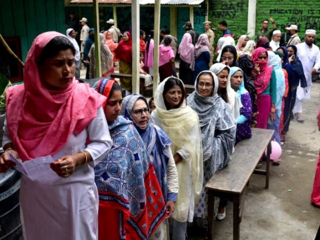 women wait to cast their votes at a polling station during the first phase of the general election in imphal manipur india april 19 2024 photo reuters
