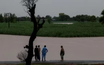 residents stand on a higher ground with the flooded field in the background following monsoon rains and rising water levels of the chenab river in patraki village chiniot district punjab province pakistan august 30 2025 photo reuters residents stand on a higher ground with the flooded field in the background following monsoon rains and rising water levels of the chenab river in patraki village chiniot district punjab province pakistan august 30 2025 photo reuters
