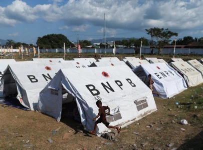 thousands evacuate after indonesia quake kills 51 cuts roads