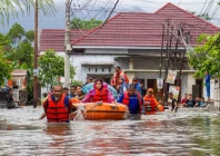 a rescue team evacuates women and children in a rubber boat as tuesday photo afp