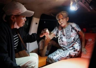 local people rescue an elderly woman during a fire at werdha damai retirement home in manado north sulawesi province indonesia december 28 2025 photo reuters
