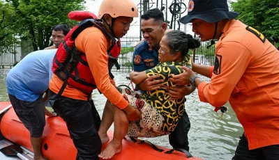 rescuers evacuate an elderly person using a rubber boat during the flood in medan north sumatra on november 28 2025 photo afp