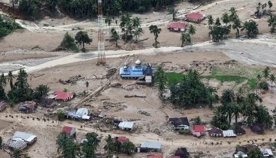 a mosque stands at an area hit by deadly flash floods in palembayan agam regency west sumatra province indonesia november 30 2025 photo reuters