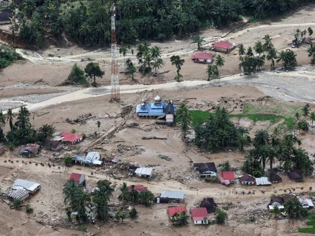a mosque stands at an area hit by deadly flash floods in palembayan agam regency west sumatra province indonesia november 30 2025 photo reuters