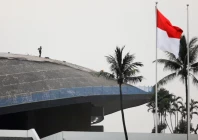a worker walks on the roof of indonesian parliament building in jakarta indonesia december 5 2022 reuters