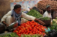 man sells vegetables at the empress market in karachi pakistan photo reuters