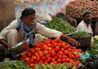 man sells vegetables at the empress market in karachi pakistan photo reuters