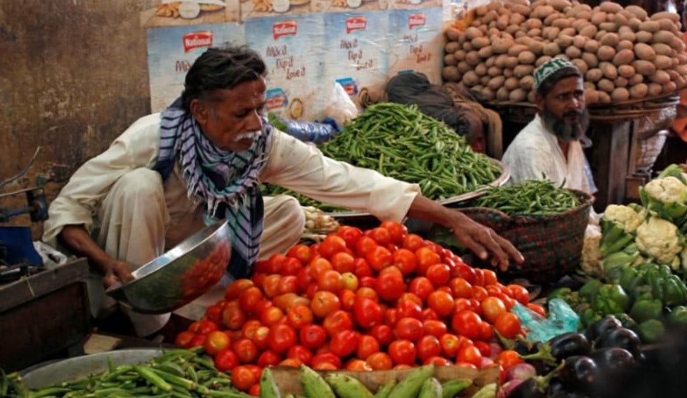 men sell vegetables at their makeshift stalls at the empress market in karachi pakistan reuters filephoto