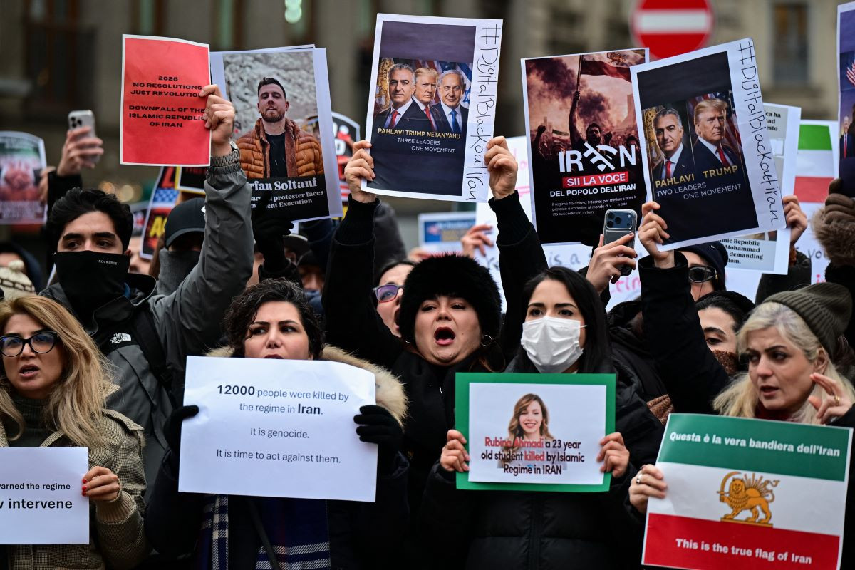 Anti-Iranian regime protesters chant slogans and hold placards during a rally outside the US Consulate in Milan on January 13, 2026.AFP