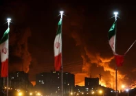 iranian flags fly as fire and smoke from an israeli attack on sharan oil depot rise following israeli strikes on iran in tehran iran photo reuters