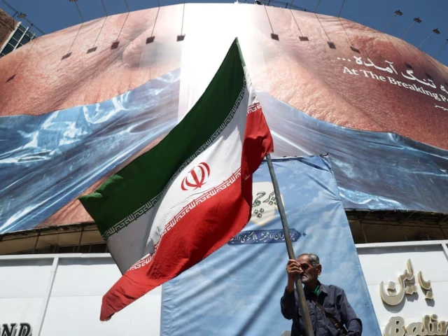 a man holds an iranian flag near an anti u s billboard depicting us president donald trump and the strait of hormuz in tehran iran may 30 2026 wana west asia news agency via reuters a man holds an iranian flag near an anti u s billboard depicting us president donald trump and the strait of hormuz in tehran iran may 30 2026 wana west asia news agency via reuters