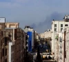a plume of smoke rises following a reported explosion in tehran photo afp