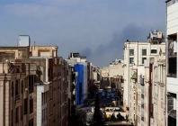 a plume of smoke rises following a reported explosion in tehran photo afp