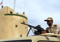 an iranian border guard keeps watch at a patrol post in milak southeastern iran file photo reuters