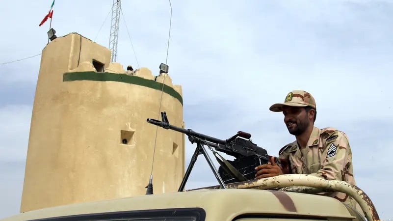 an iranian border guard keeps watch at a patrol post in milak southeastern iran file photo reuters