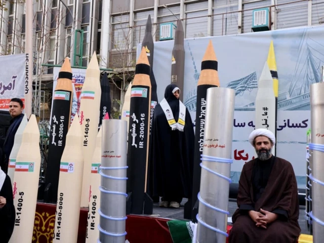 replicas of missiles are displayed along the parade route in tehran photo afp
