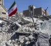 an iranian flag is planted in the rubble of a police station damaged in airstrikes in tehran iran photo reuters