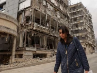 a woman walks on the street following an israeli and u s strike on gandhi hotel hospital amid the u s  israel conflict with iran in tehran iran march 2 2026