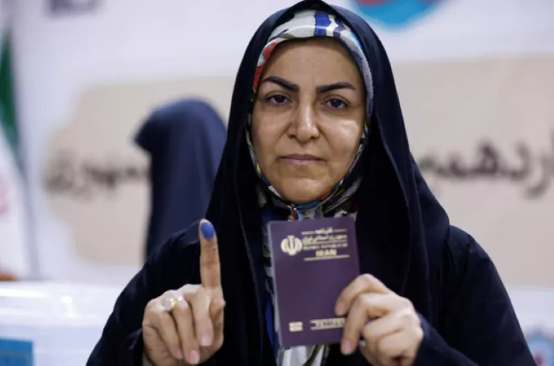 a woman shows her inked finger after voting in a snap presidential election to choose a successor to ebrahim raisi following his death in a helicopter crash at the iranian consulate in najaf iraq june 28 2024 photo reuters a woman shows her inked finger after voting in a snap presidential election to choose a successor to ebrahim raisi following his death in a helicopter crash at the iranian consulate in najaf iraq june 28 2024 photo reuters
