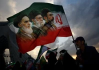 a man holds a flag with a picture of late leader of the islamic revolution ayatollah ruhollah khomeini late supreme leader of iran ayatollah ali khamenei and iran s new supreme leader mojtaba khamenei during a rally in tehran iran april 29 2026 photo reuters file