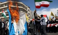 iranians burn an israeli flag during a rally marking quds day and the funeral of members of the islamic revolutionary guard corps who were killed in a suspected israeli airstrike on the iranian embassy complex in the syrian capital damascus in tehran iran april 5 2024 photo reuters