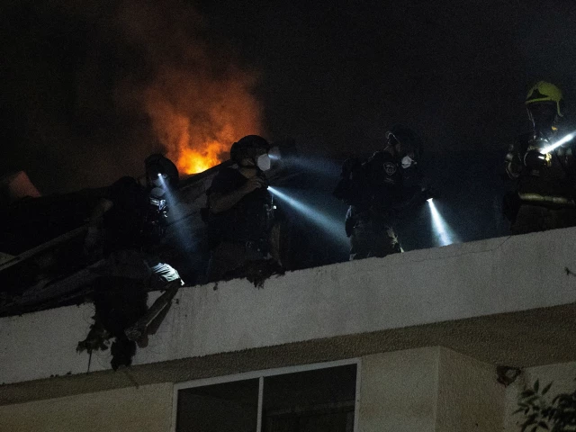 rescue workers inspect a residential building that was hit following an iranian missile strike amid the u s israeli conflict with iran in central israel march 13 2026 photo reuters rescue workers inspect a residential building that was hit following an iranian missile strike amid the u s israeli conflict with iran in central israel march 13 2026 photo reuters