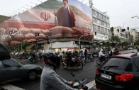 people ride motorcycles near a billboard featuring an image of iran s supreme leader mojtaba khamenei amid a ceasefire between us and iran in tehran iran april 20 2026 photo reuters file
