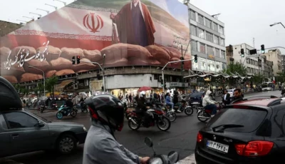 people ride motorcycles near a billboard featuring an image of iran s supreme leader mojtaba khamenei amid a ceasefire between us and iran in tehran iran april 20 2026 photo reuters file